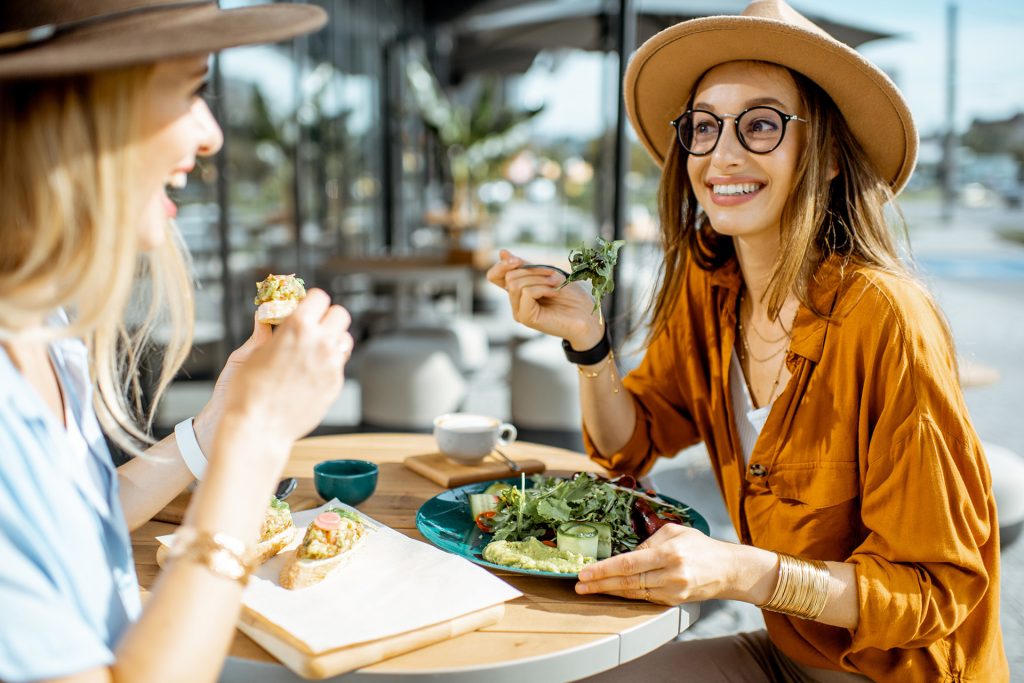 Two girls eating healthy food
